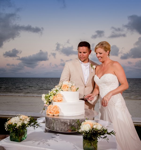 Moon Palace Custom wedding cake couple cutting cake