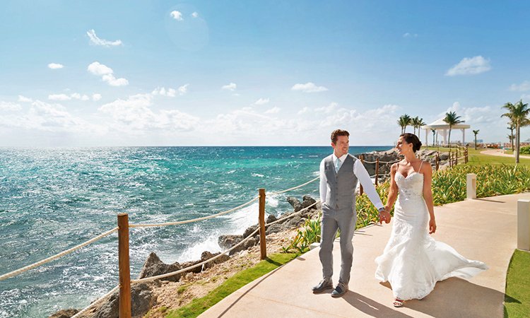 Hyatt Ziva Cancun Weddings_-Ceremony Couple wlaking down the asile