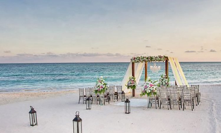 Dreams Riviera Cancun Weddings_ Elegant Beach Ceremony location Decorations