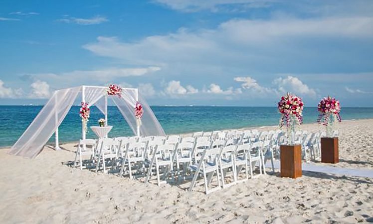 Secrets Playa Mujeres Weddings_Elegant Beach Ceremony flowers decorations