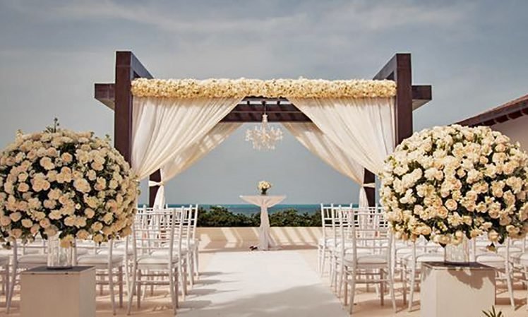 Secrets Playa Mujeres Weddings_Luxury Ocean Front Ceremony flower decorations